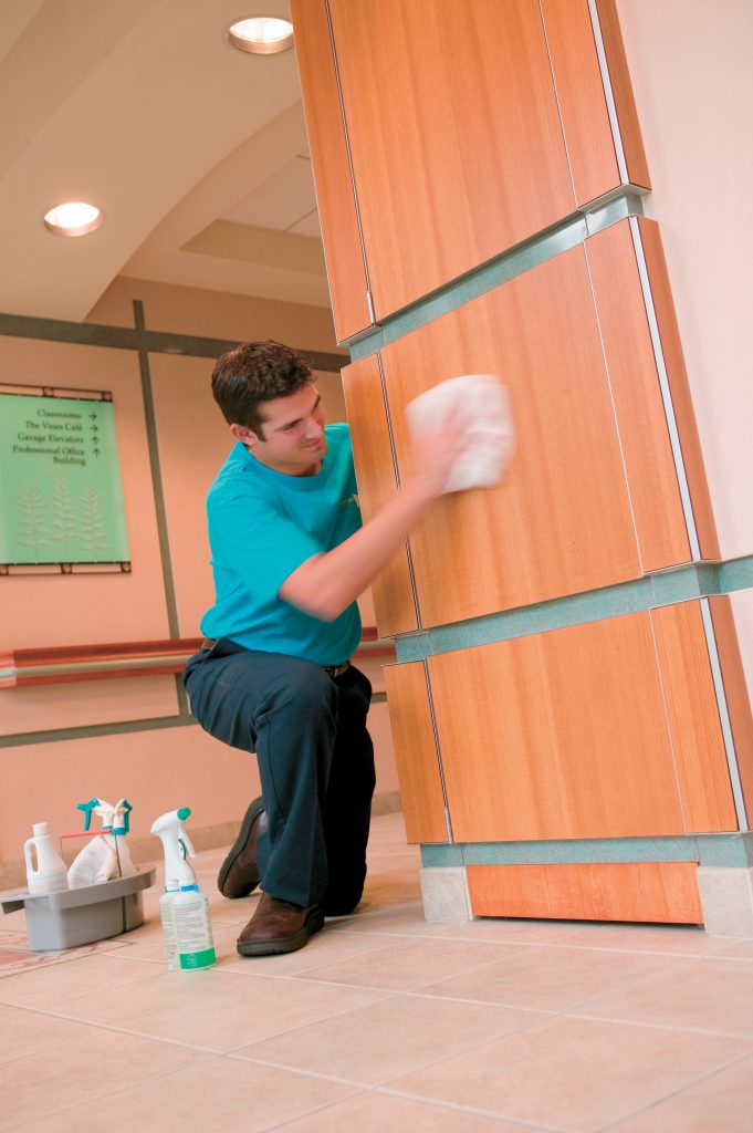 ServiceMaster cleaning employee at a company pillar